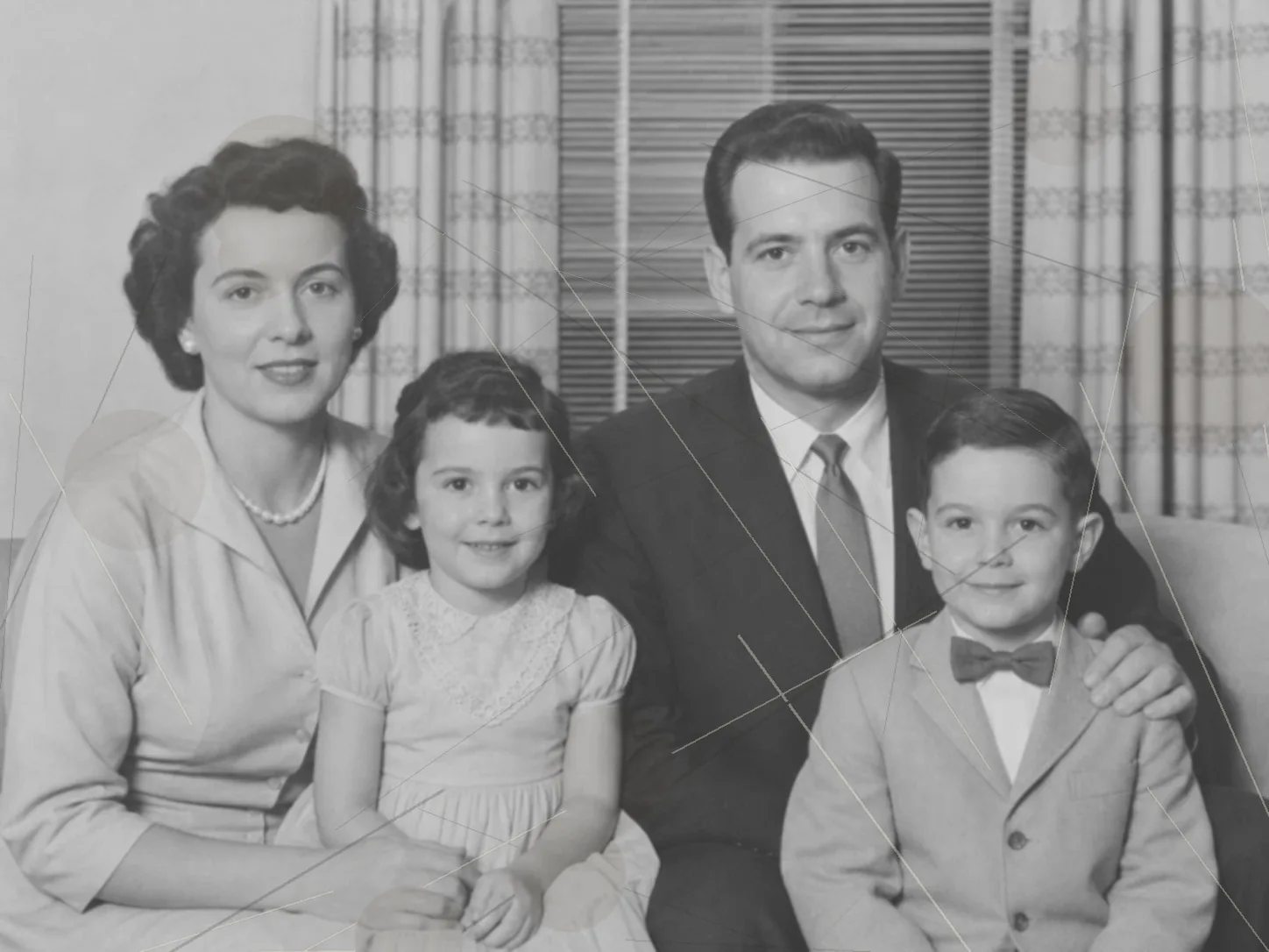 Damaged family portrait before AI photo restoration