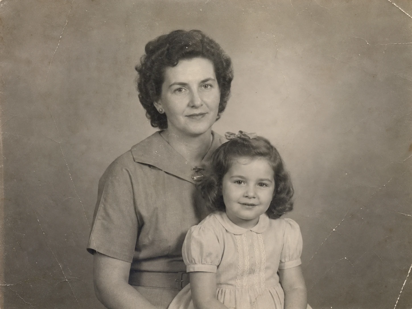 Damaged family portrait before AI photo restoration