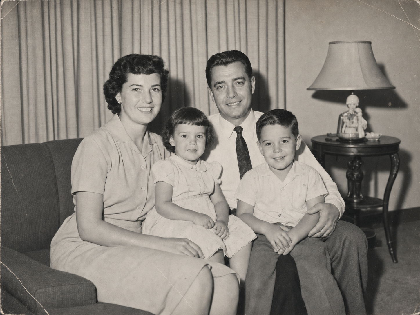 Damaged family portrait before AI photo restoration